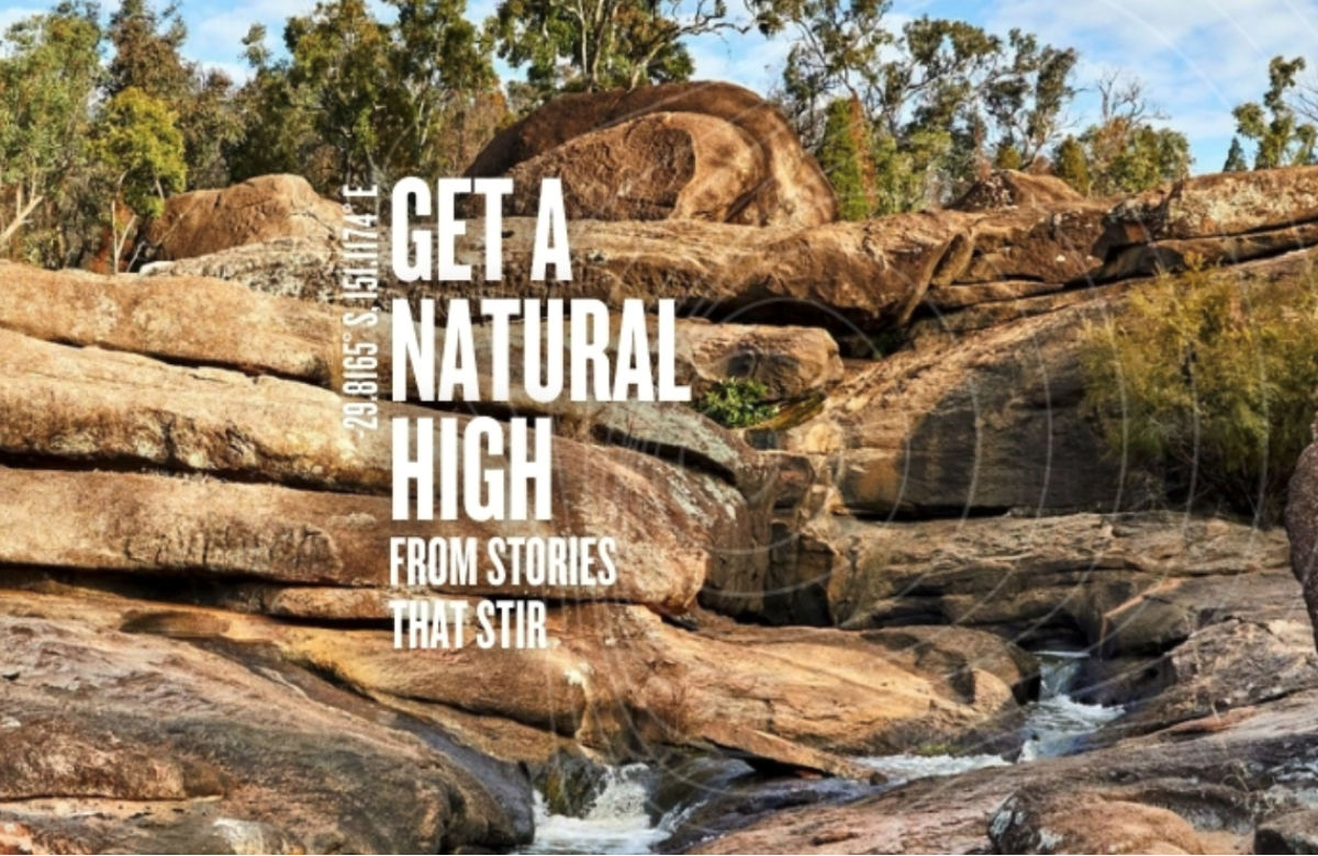 Photo of sandstone coloured beige rocks and some shrubs with text overlay saying 'GET A NATURAL HIGH FROM STORIES THAT STIR.'