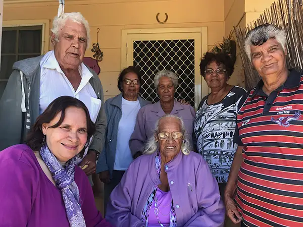 Photo of a group of elders on a porch