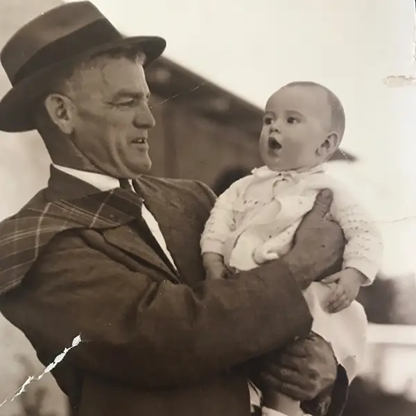 Black and white image of man and child