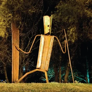A photo of a metal sculpture in a park
