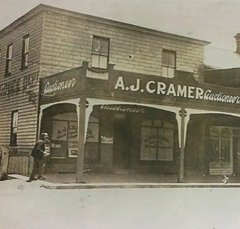 old photograph of a shop front - the General Store - a building made of wood.