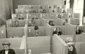 vintage black and white image of students in language lab cubicles
